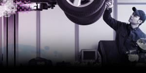 Mechanic looking at car 
