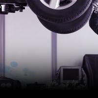 Mechanic looking at car 